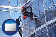 colorado map icon and a window washer, washing office building windows