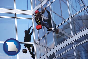 a window washer, washing office building windows - with Missouri icon