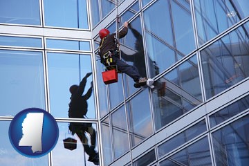 a window washer, washing office building windows - with Mississippi icon