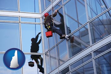 a window washer, washing office building windows - with New Hampshire icon
