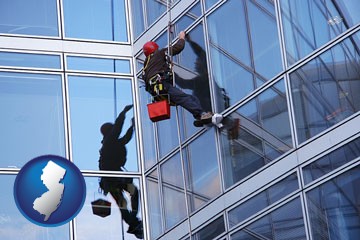 a window washer, washing office building windows - with New Jersey icon