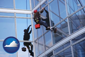 a window washer, washing office building windows - with Virginia icon