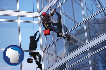 a window washer, washing office building windows - with Wisconsin icon