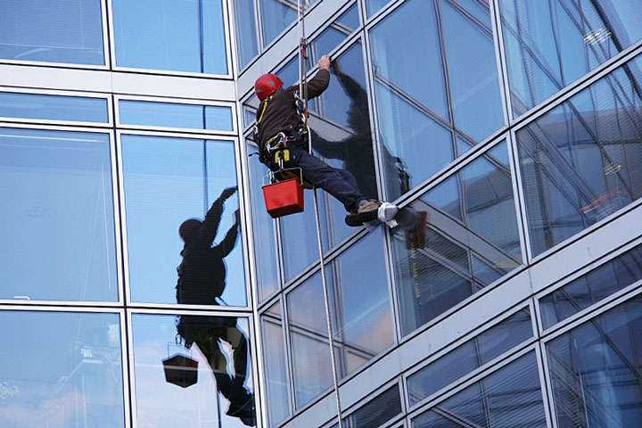 a window washer, washing office building windows